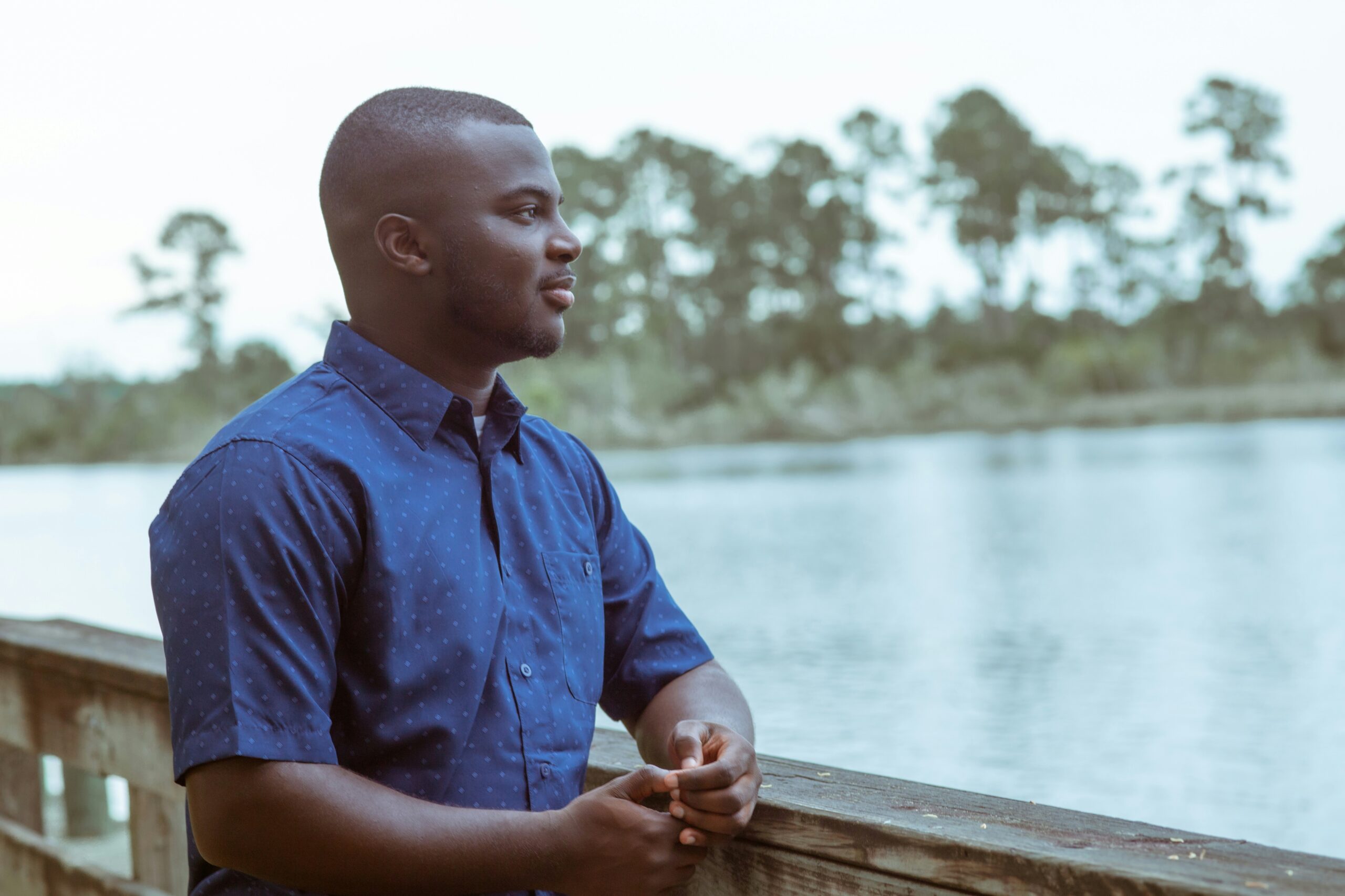 African American man looking out over the water