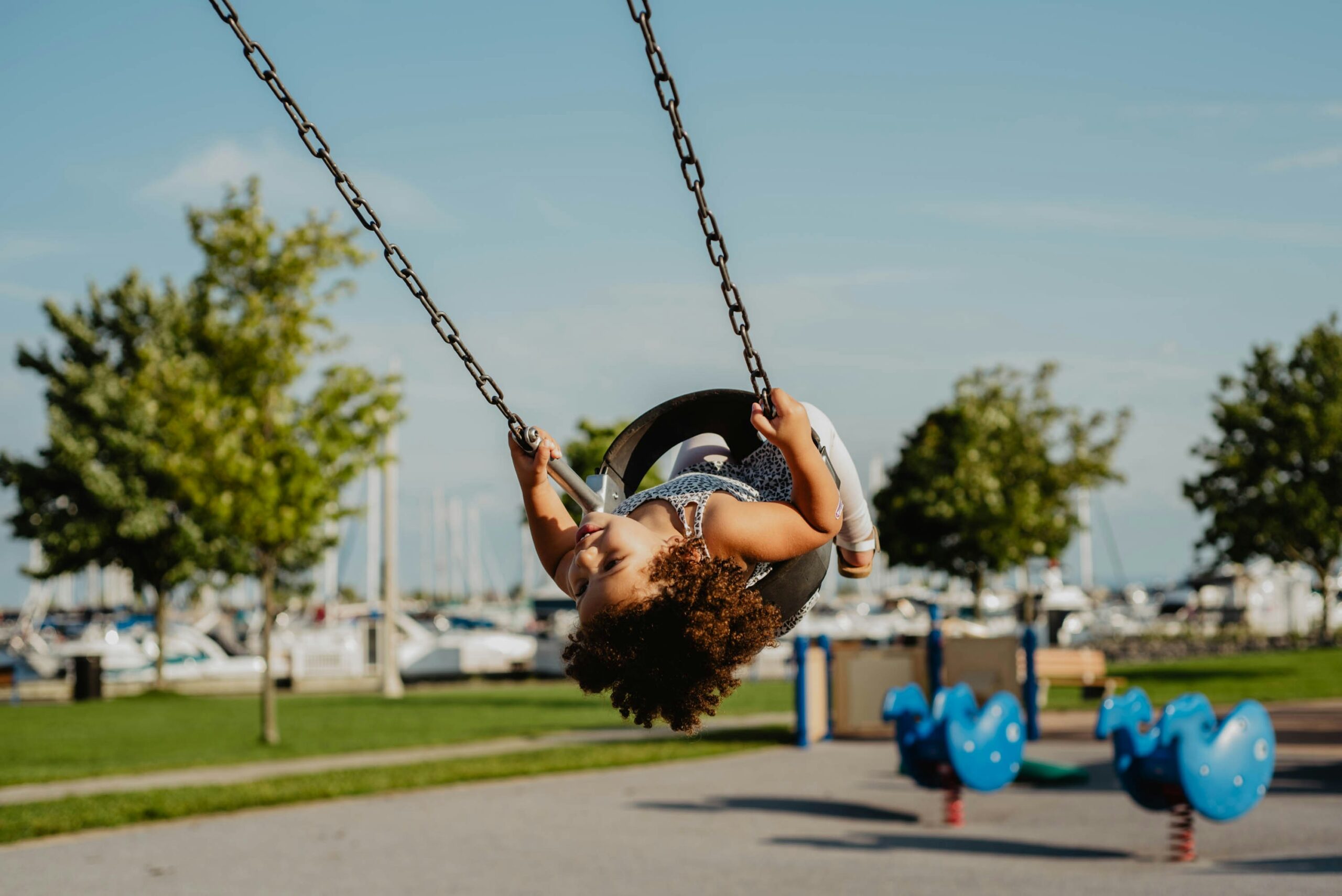 a child swinging in a swing