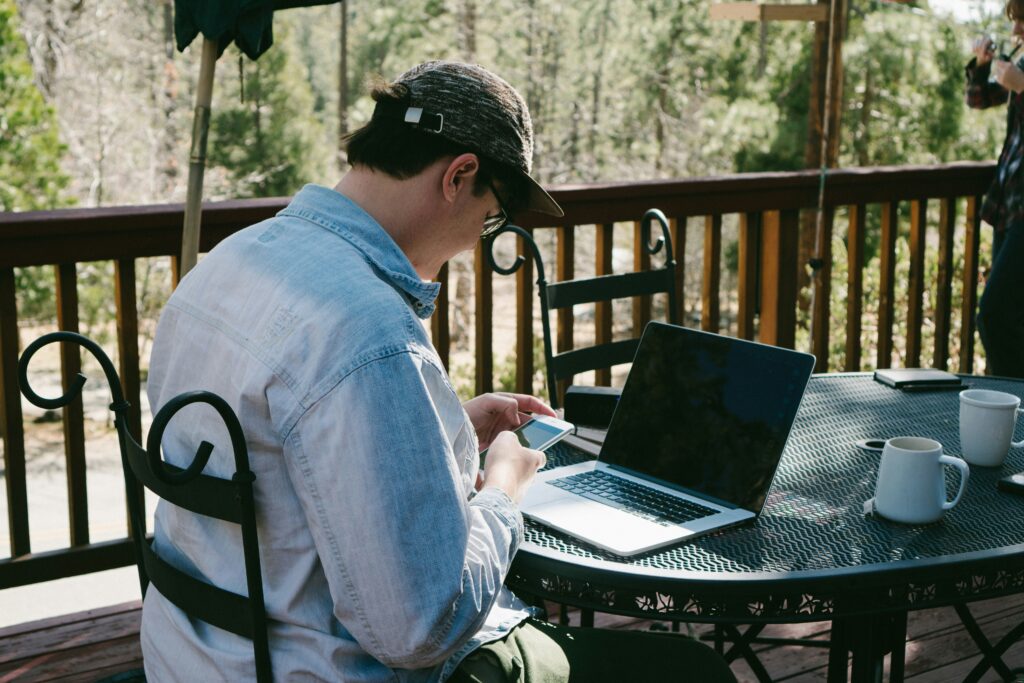 man struggling with addiction to phone and social media