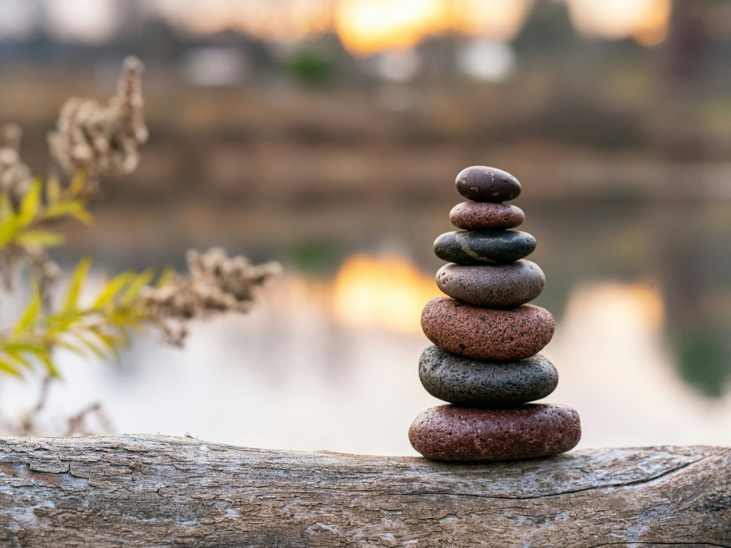 stones balanced by the water representing the upward spiral method